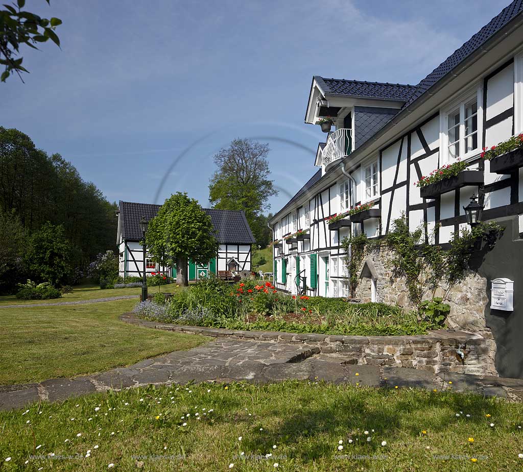 wipperfuerth joergensmuehle, restauriertes Fachwerkhaus historische Wassermuehle mit Scheune, Weg und Treppe aus Natursteinplatten mit Garten, Blumenbeet; Wipperfuerth-Joergensmuhle half timbered house, historical water mill