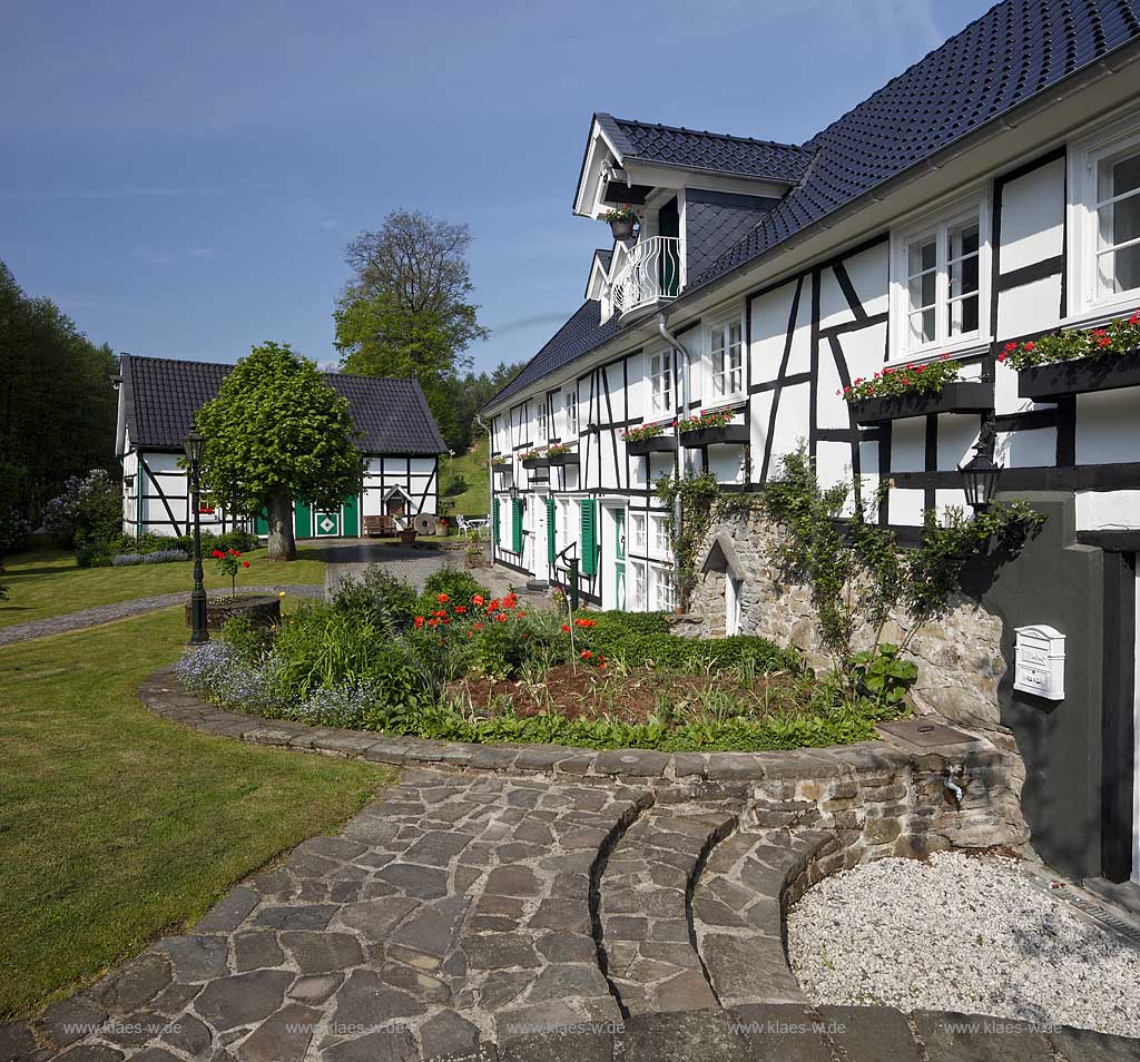 wipperfuerth joergensmuehle, restauriertes Fachwerkhaus historische Wassermuehle mit Scheune, Weg und Treppe aus Natursteinplatten mit Garten, Blumenbeet; Wipperfuerth-Joergensmuhle half timbered house, historical water mill
