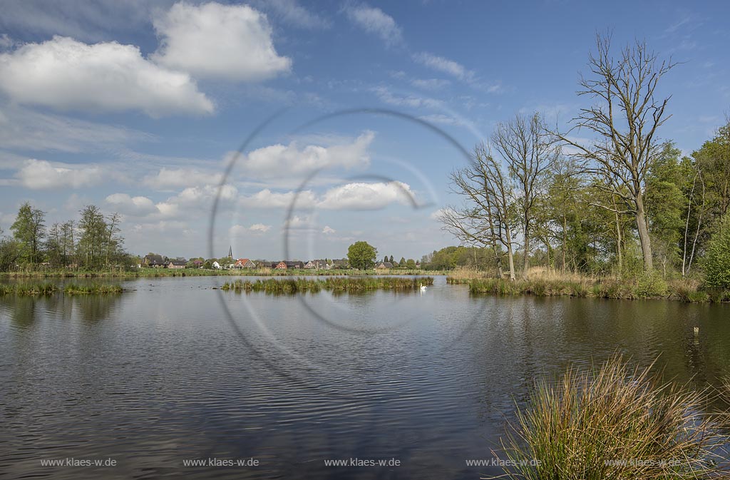 Nettetal, Naturpark Schwalm-Nette,  Grosser De-Witt-See, im Hintergrund der Ort Leuth im Fruehling mit Wolkenstimmung; Nettetal, lake Grosser De-Witt-See with village Leuth in the background.